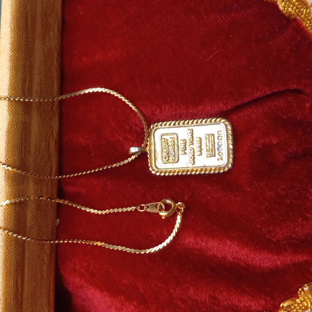 Gold tone necklace pendant on chain
